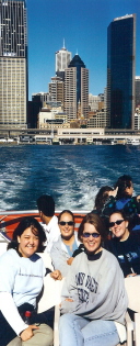 Students on Boat, City in Background